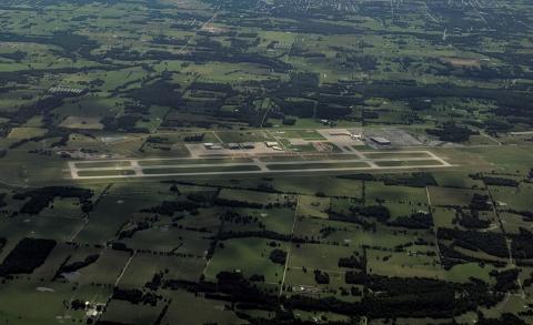 View of airfield from the west on departing airliner with underconstruction taxiway