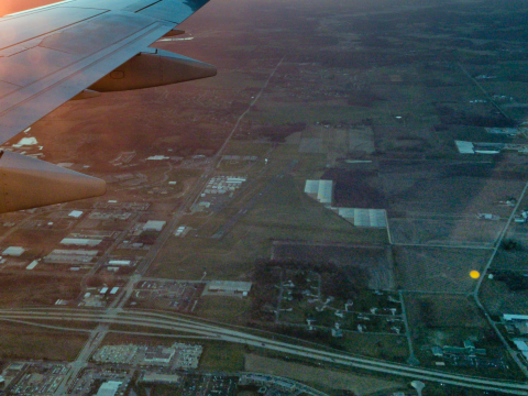 Runway 28 at C29 as seen from an E175 during sunset