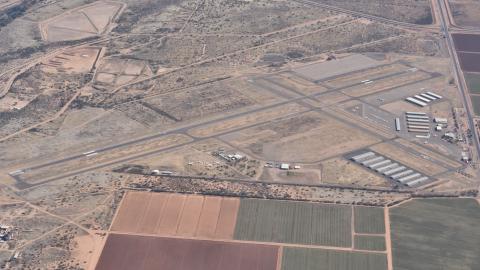 An aerial view of Marana Regional Airport (KAVQ) taken from the west looking east, early afternoon.