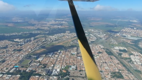 Aerial view of Rio Claro took inside an Aeronca 15AC with a clouds covering part of the airport