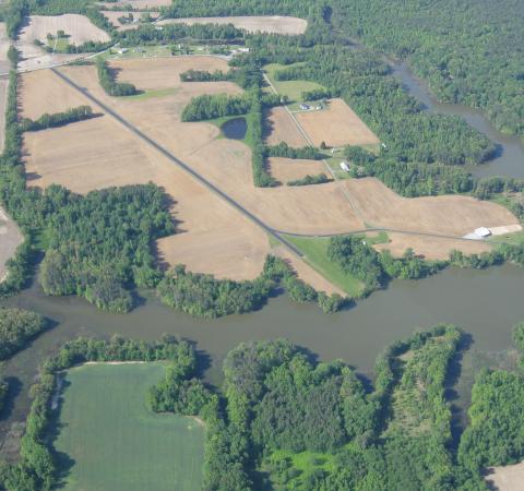 Aerial view of Whithall airport (1VG2) looking NW