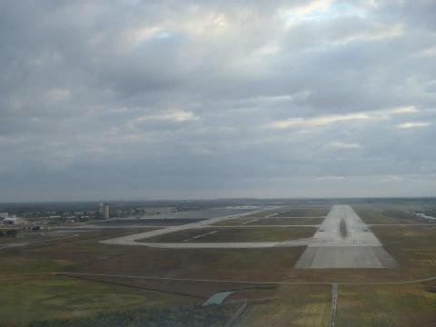 View if the 300ft wide runway at HST during a low approach